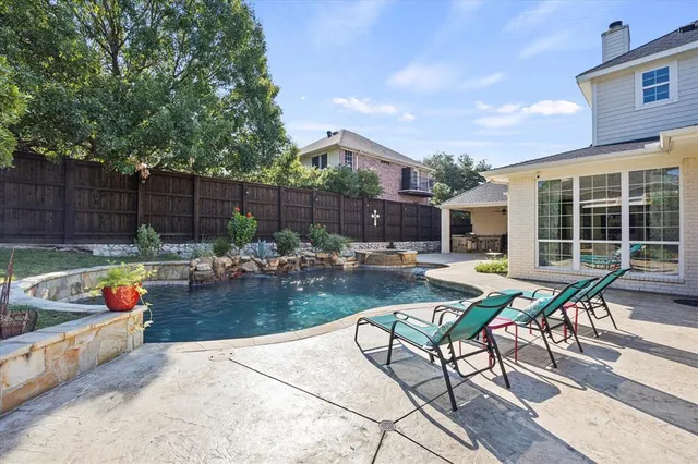 a view of a backyard with sitting area and furniture