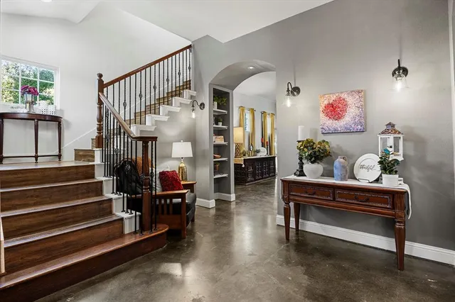 a living room with furniture and a rug