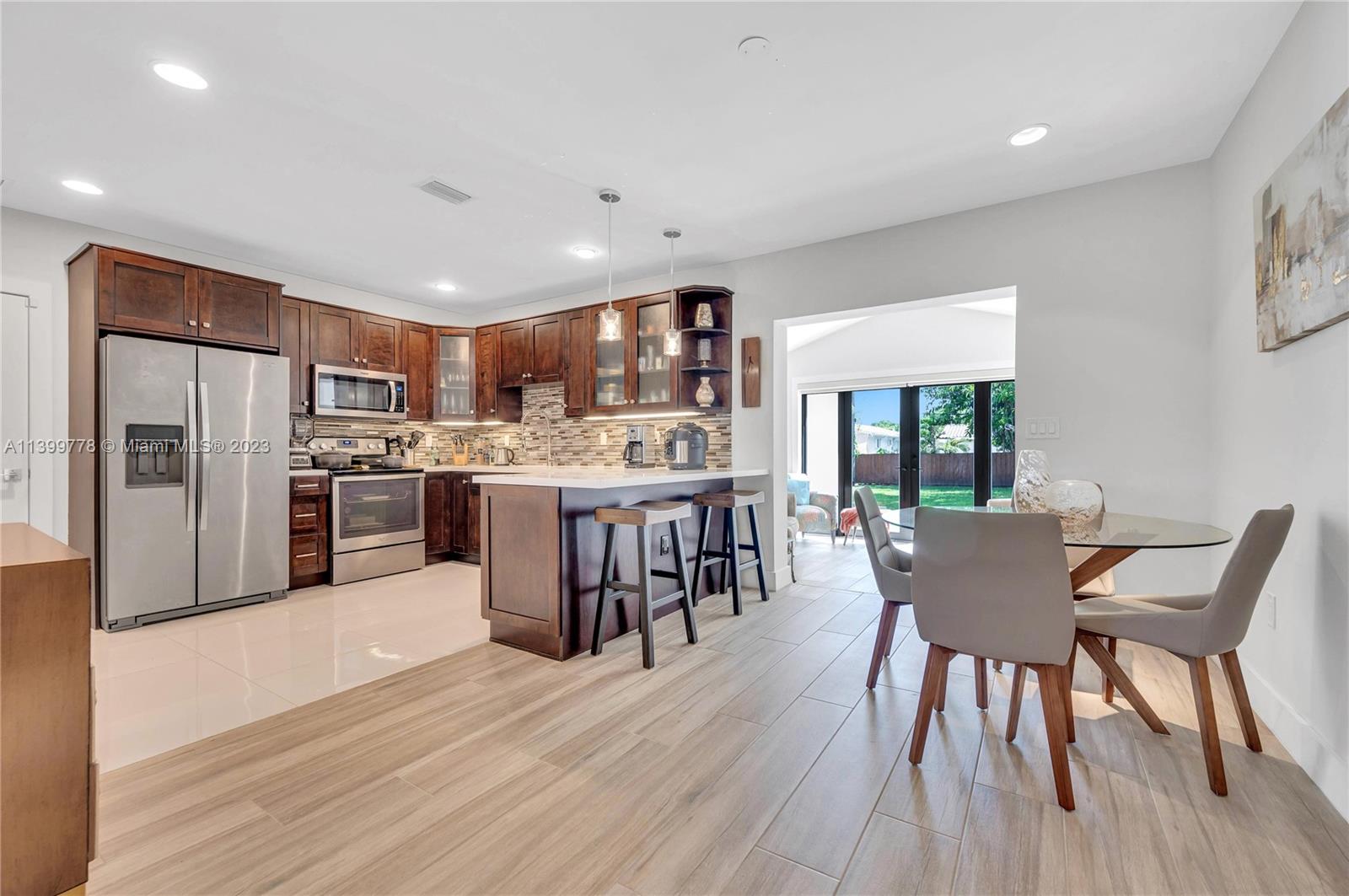 801 Southwest 28th Road Miami, FL 33129 - Photo 11 of 40 a dining room with furniture and wooden floor