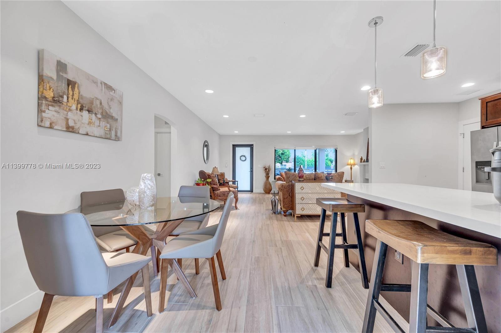 801 Southwest 28th Road Miami, FL 33129 - Photo 14 of 40 a view of a dining room with furniture and wooden floor