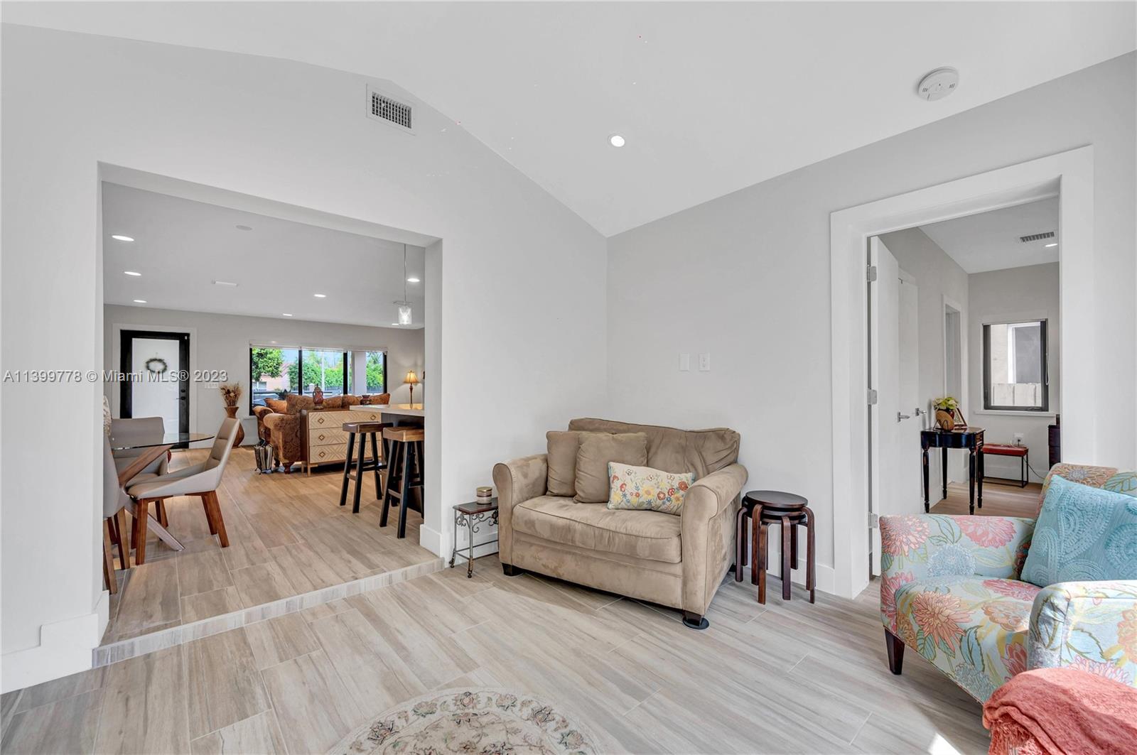 801 Southwest 28th Road Miami, FL 33129 - Photo 16 of 40 a living room with furniture and a wooden floor