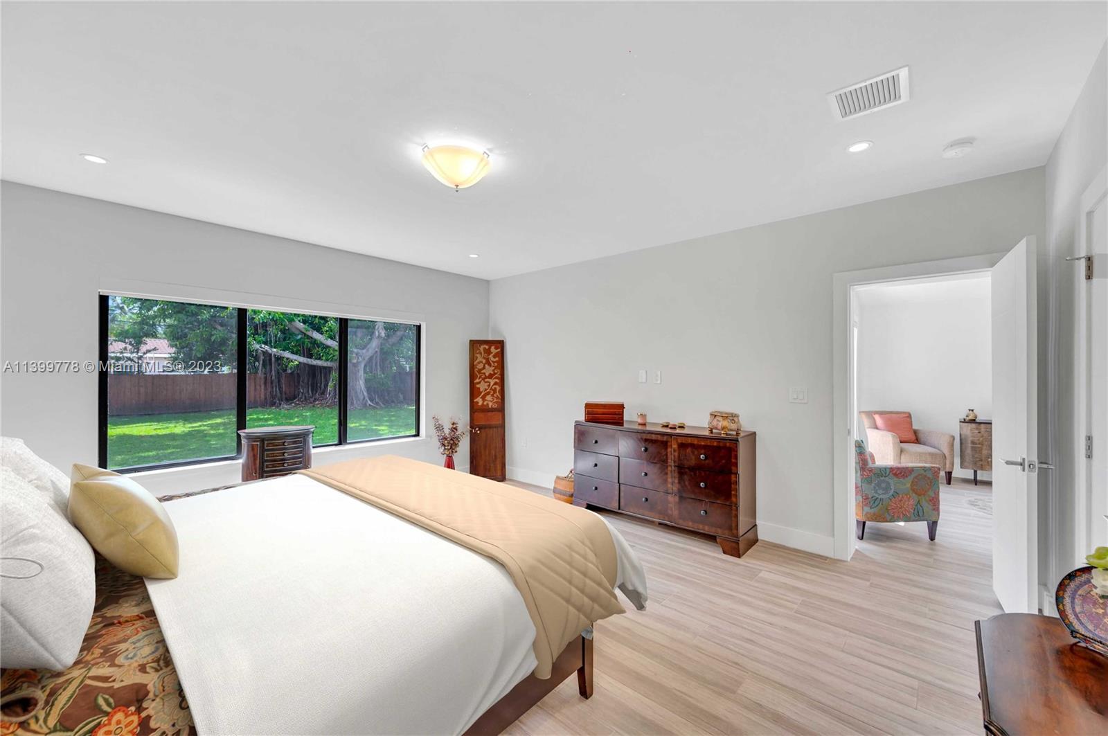 801 Southwest 28th Road Miami, FL 33129 - Photo 19 of 40 a bed room with a bed and a large window