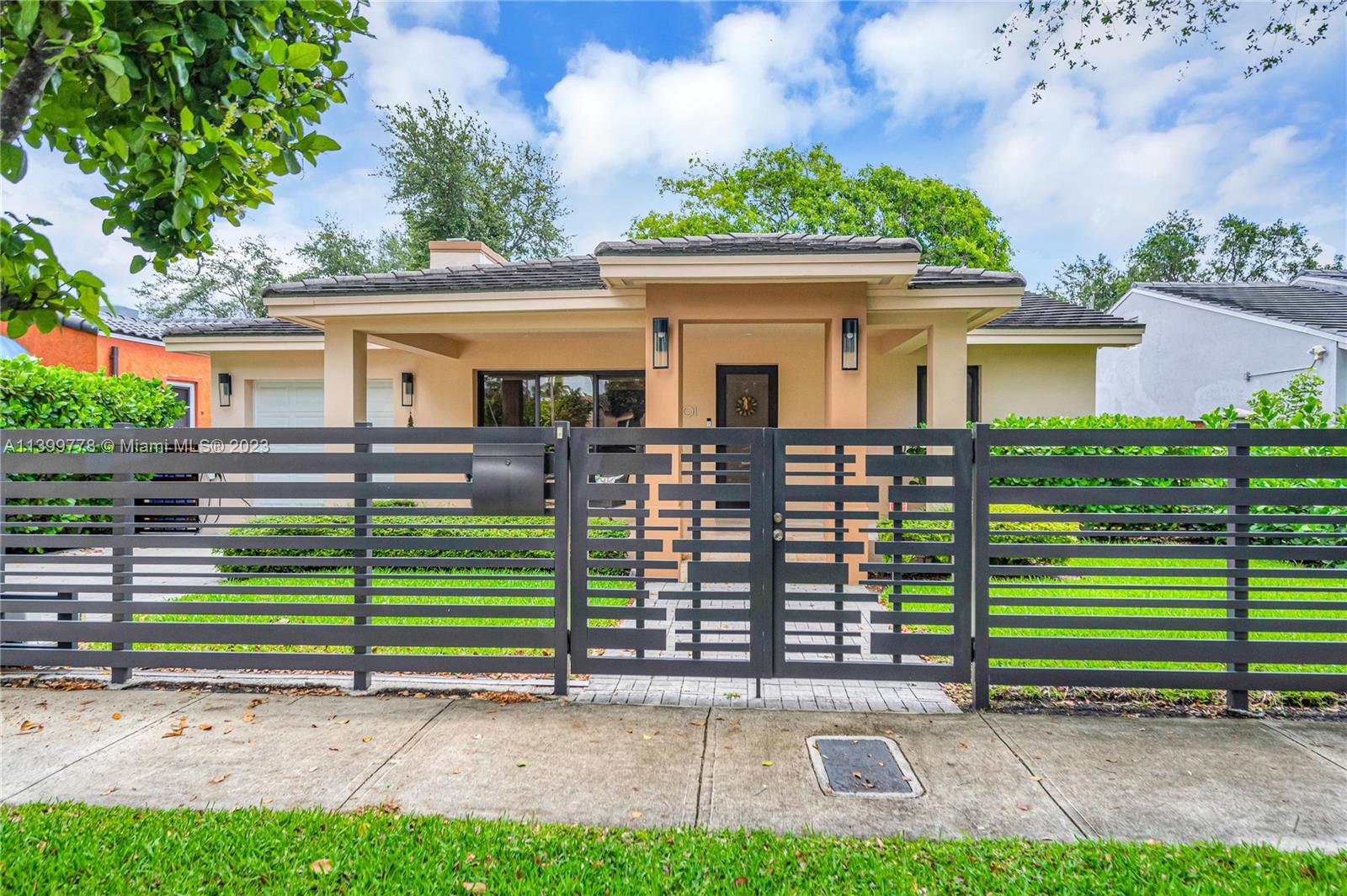 801 Southwest 28th Road Miami, FL 33129 - Photo 2 of 40 a front view of a house with a yard