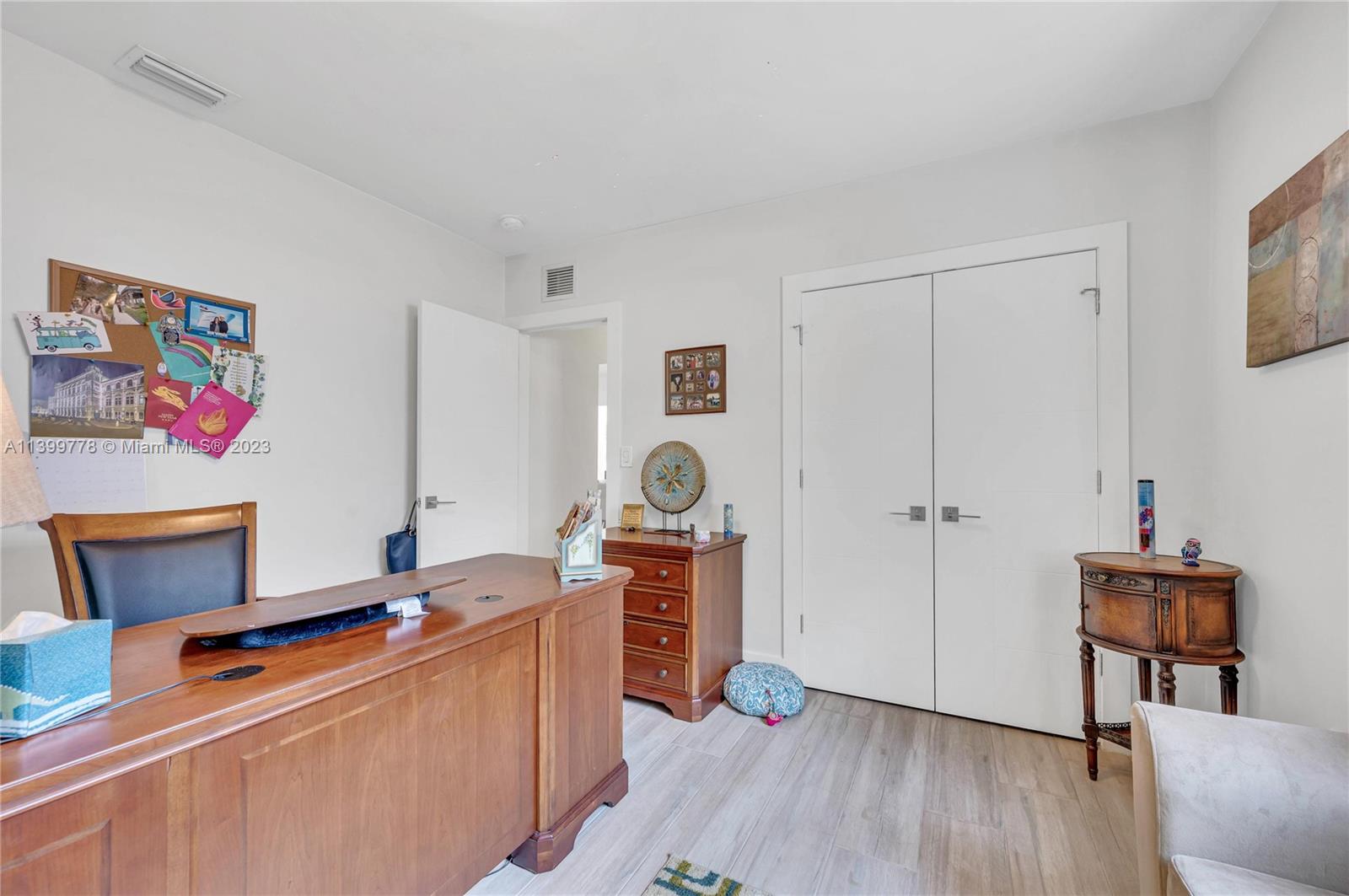 801 Southwest 28th Road Miami, FL 33129 - Photo 28 of 40 a room with furniture and wooden floor