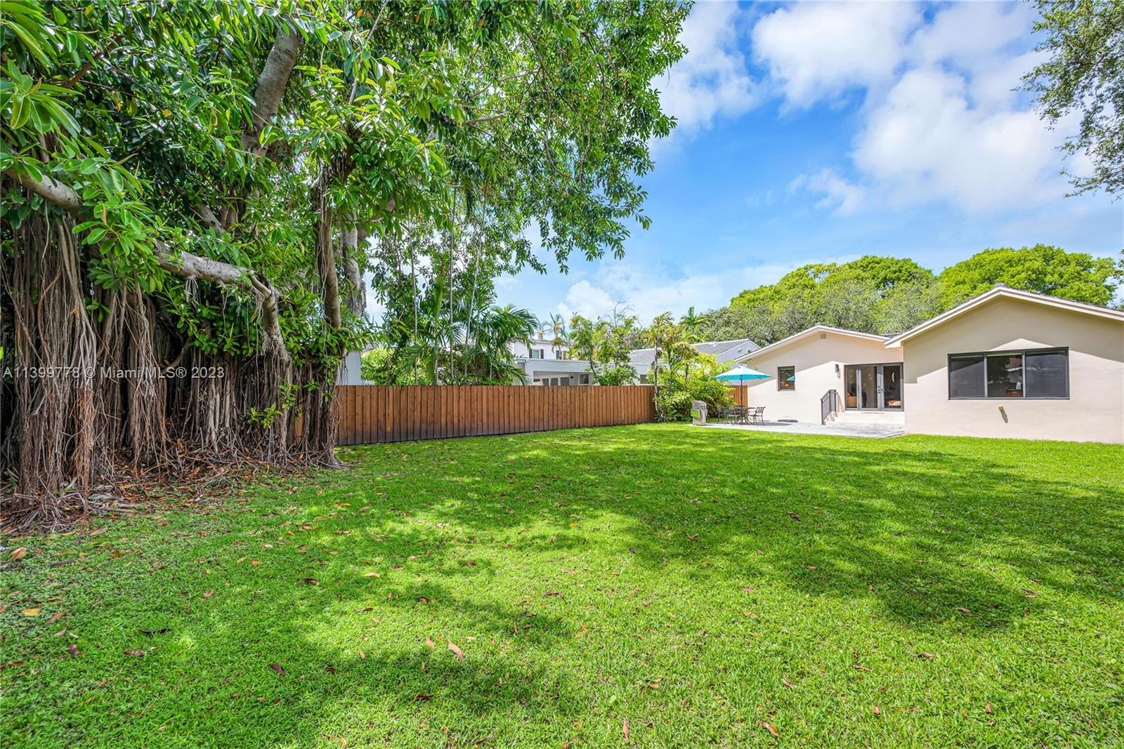 801 Southwest 28th Road Miami, FL 33129 - Photo 31 of 40 a view of house with backyard and garden
