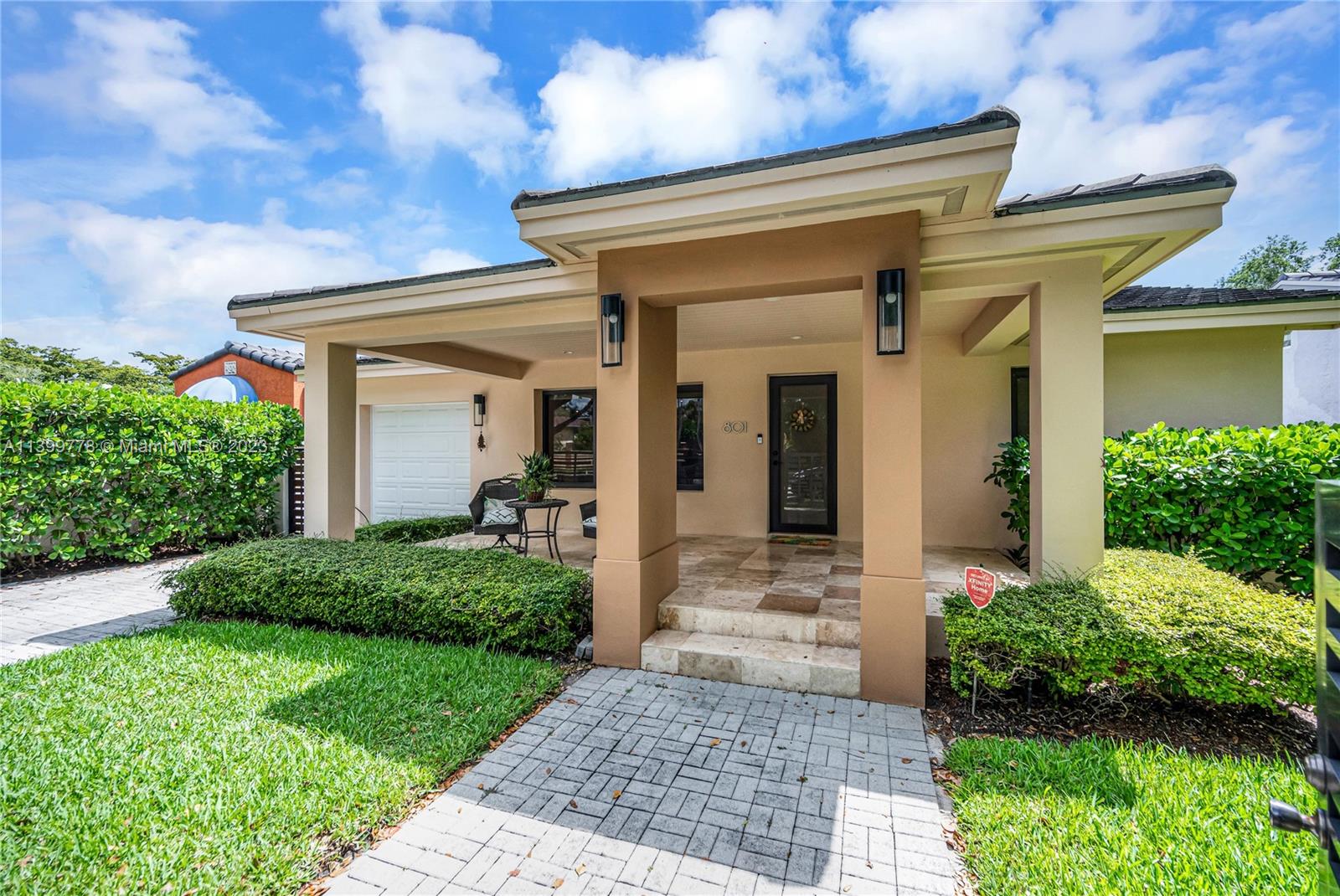 801 Southwest 28th Road Miami, FL 33129 - Photo 4 of 40 a front view of a house with a yard