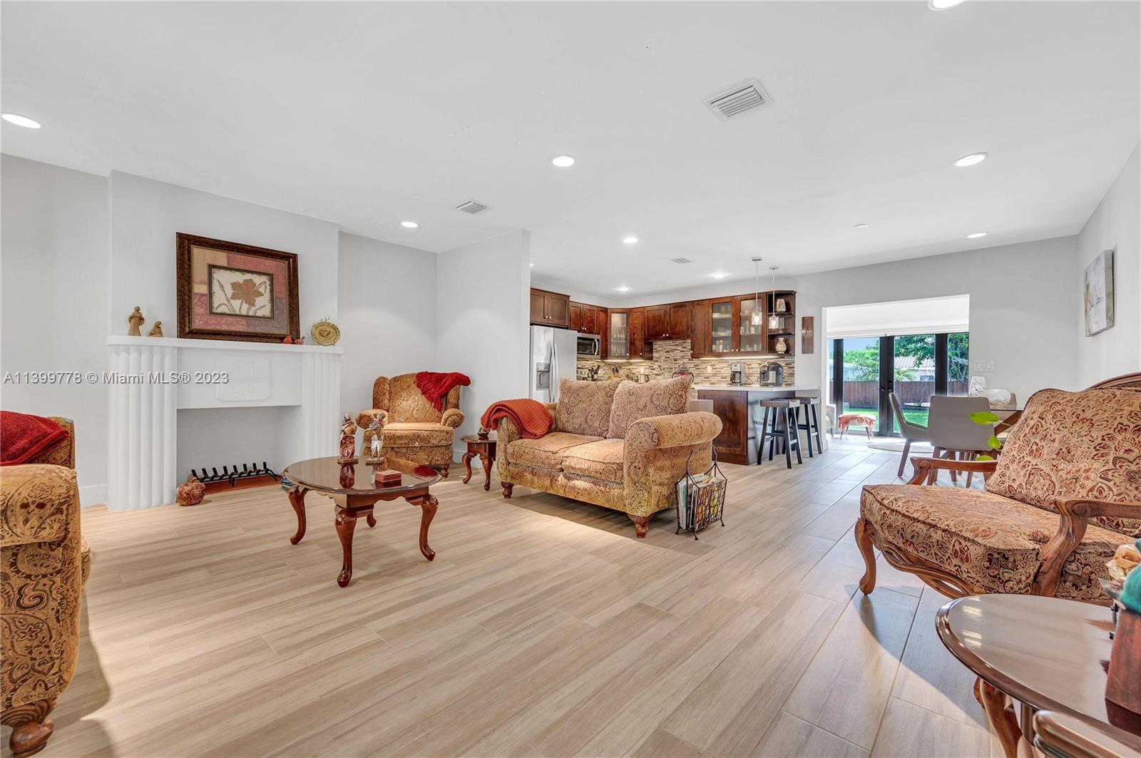 801 Southwest 28th Road Miami, FL 33129 - Photo 5 of 40 a living room with furniture and a wooden floor