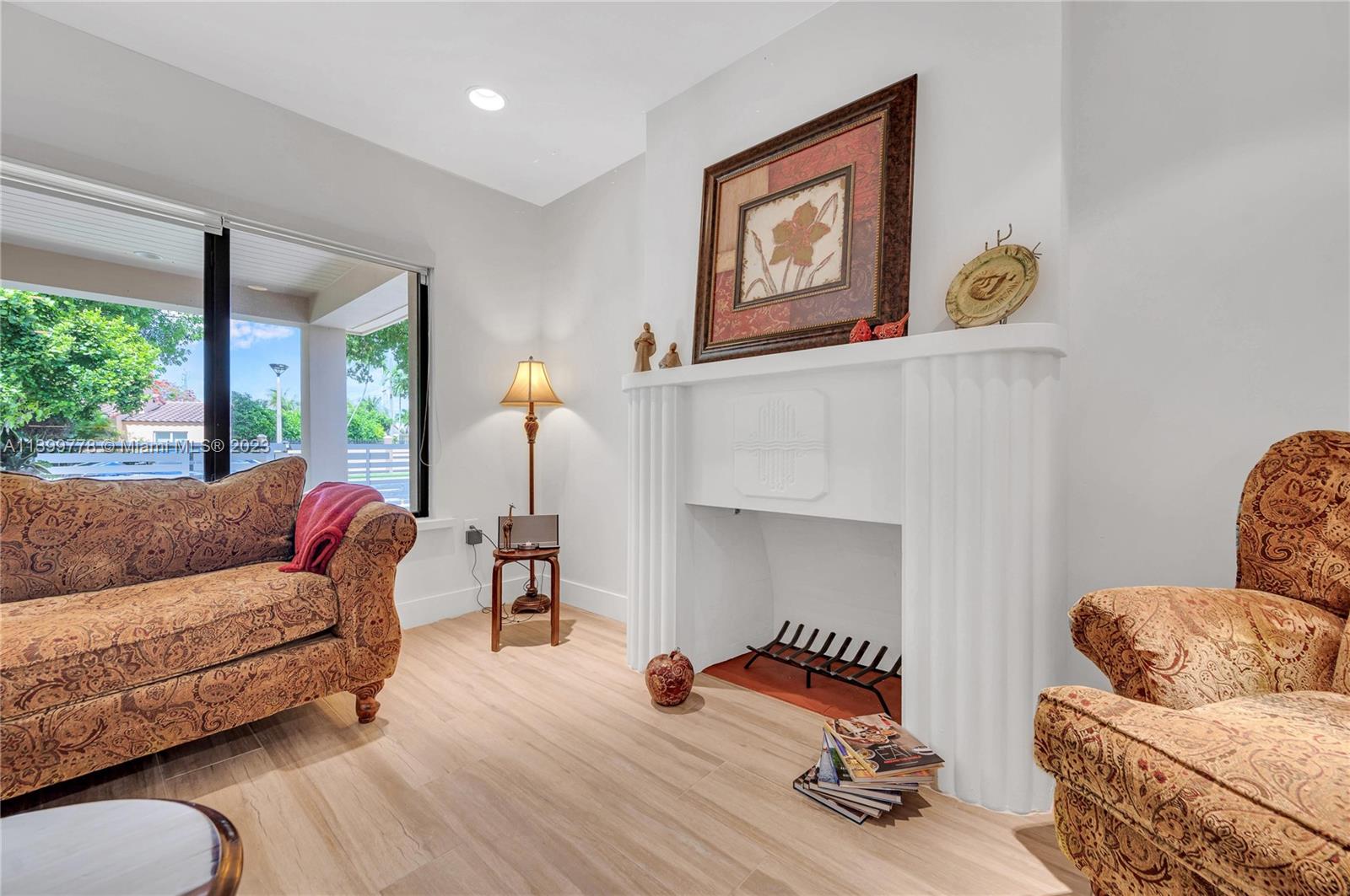 801 Southwest 28th Road Miami, FL 33129 - Photo 7 of 40 a living room with furniture and a wooden floor