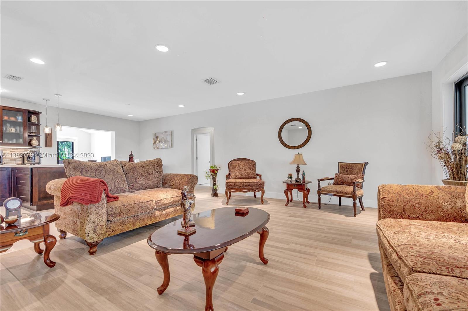 801 Southwest 28th Road Miami, FL 33129 - Photo 8 of 40 a living room with furniture a rug and a large window