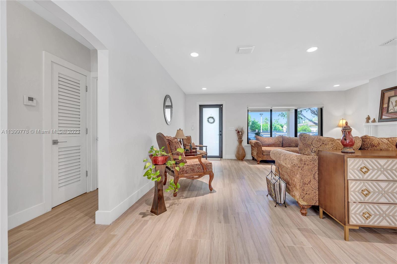 801 Southwest 28th Road Miami, FL 33129 - Photo 9 of 40 a living room with furniture and a wooden floor