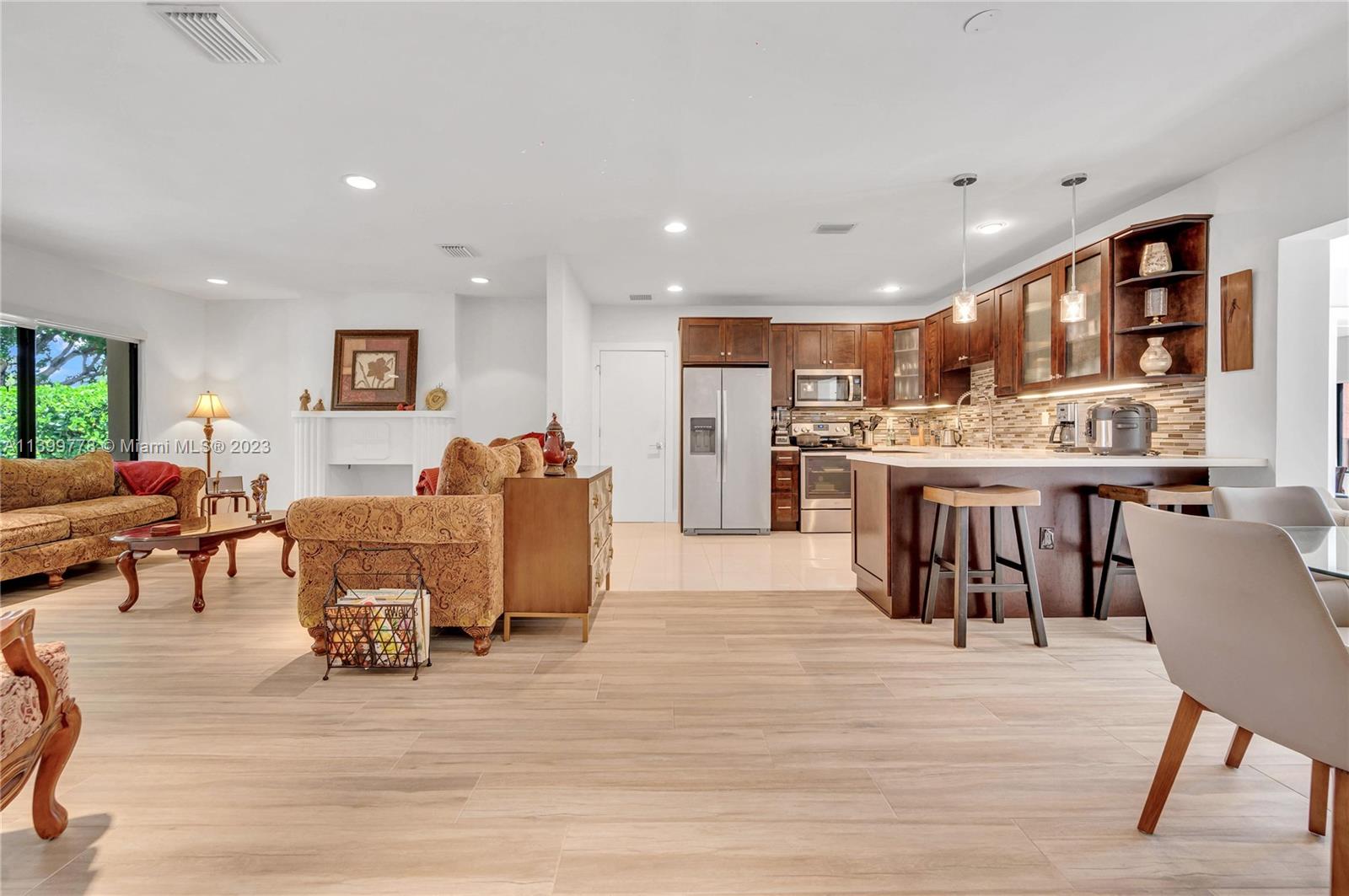 801 Southwest 28th Road Miami, FL 33129 - Photo 10 of 40 a living room with stainless steel appliances furniture and a kitchen view