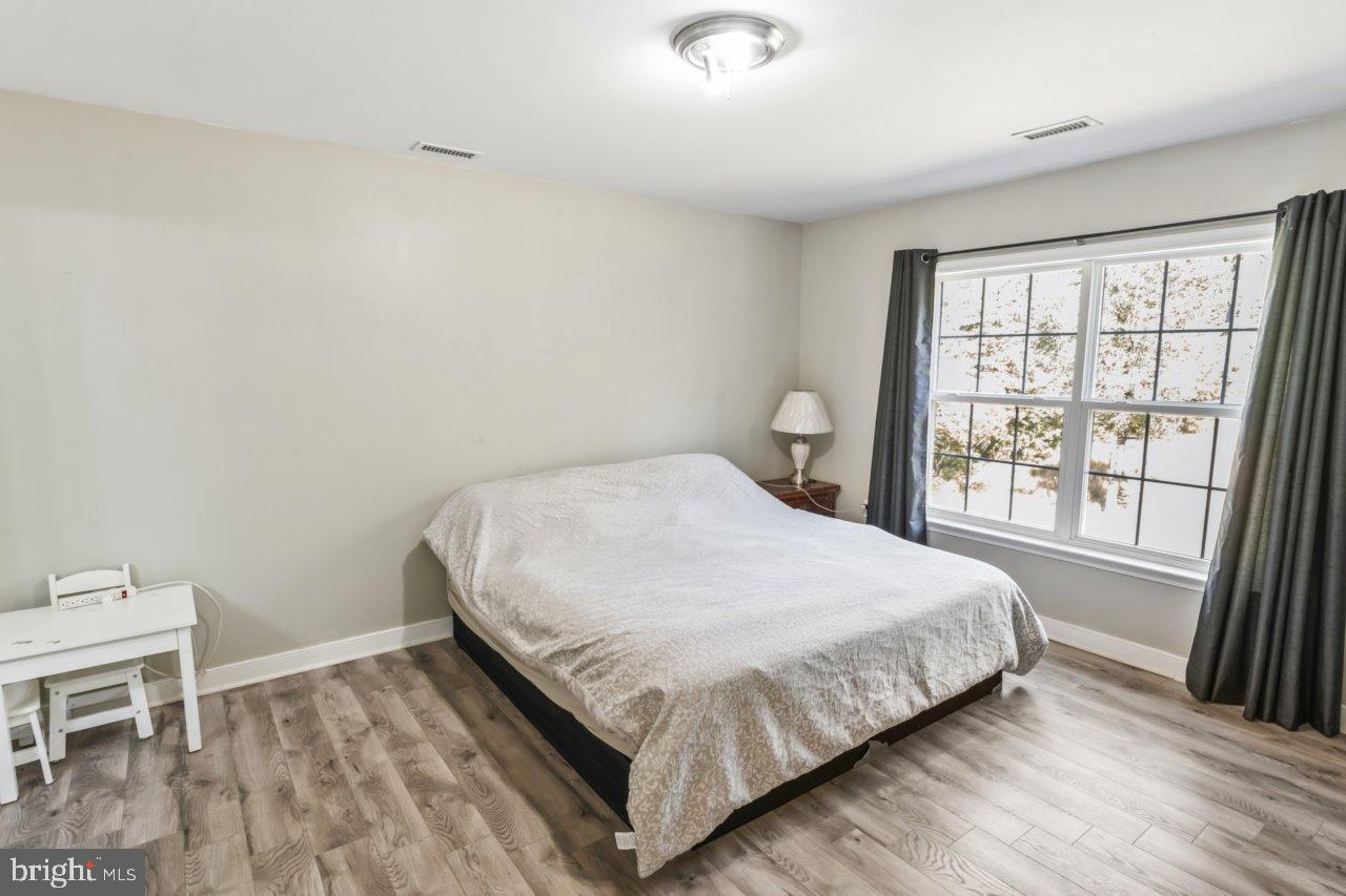 166 Bootons Lane Orange, VA 22960 - Photo 15 of 24 a bedroom with a bed and a window