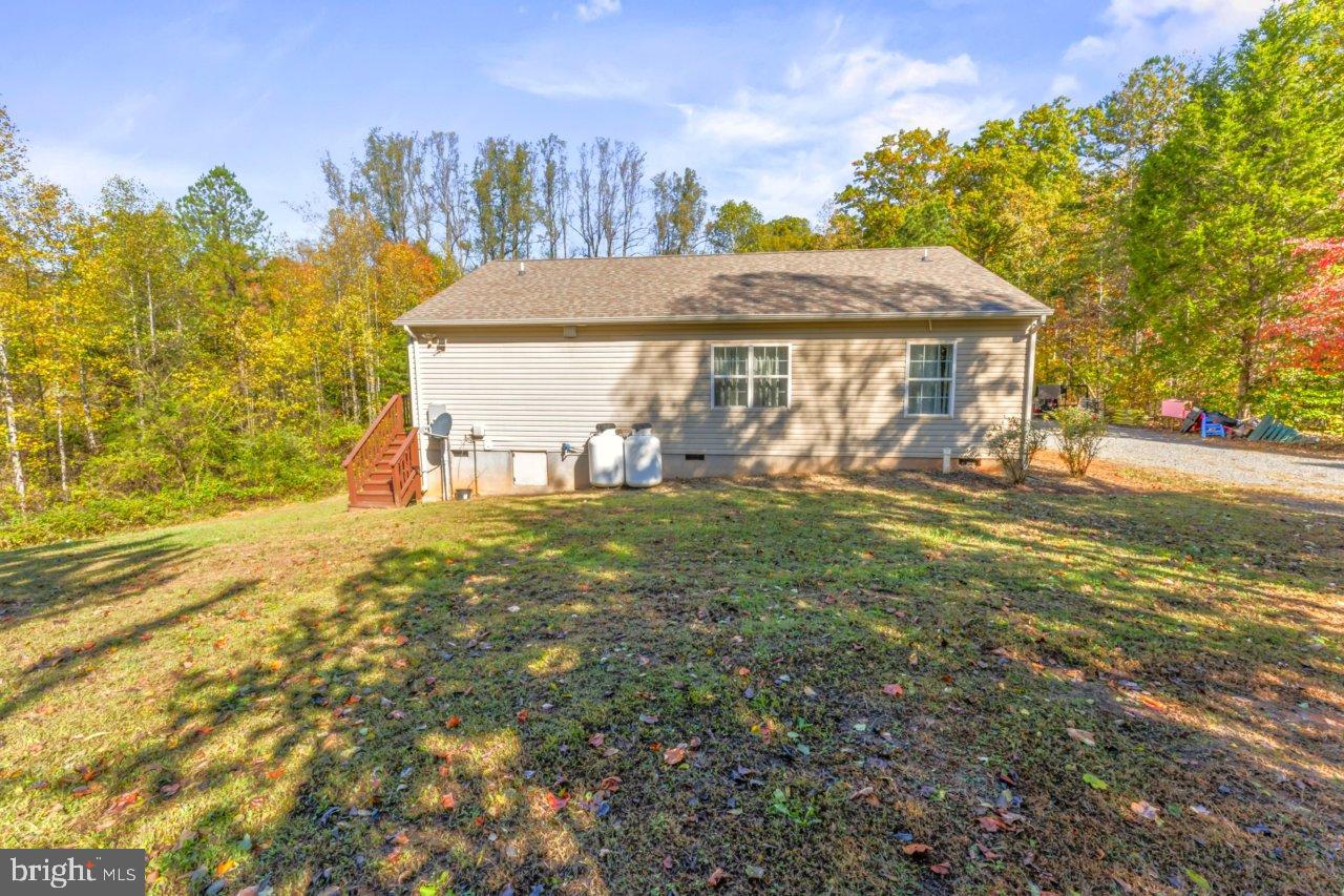 166 Bootons Lane Orange, VA 22960 - Photo 21 of 24 a view of a house with backyard and a tree
