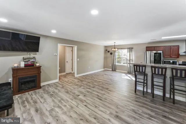 a view of a livingroom with furniture and wooden floor