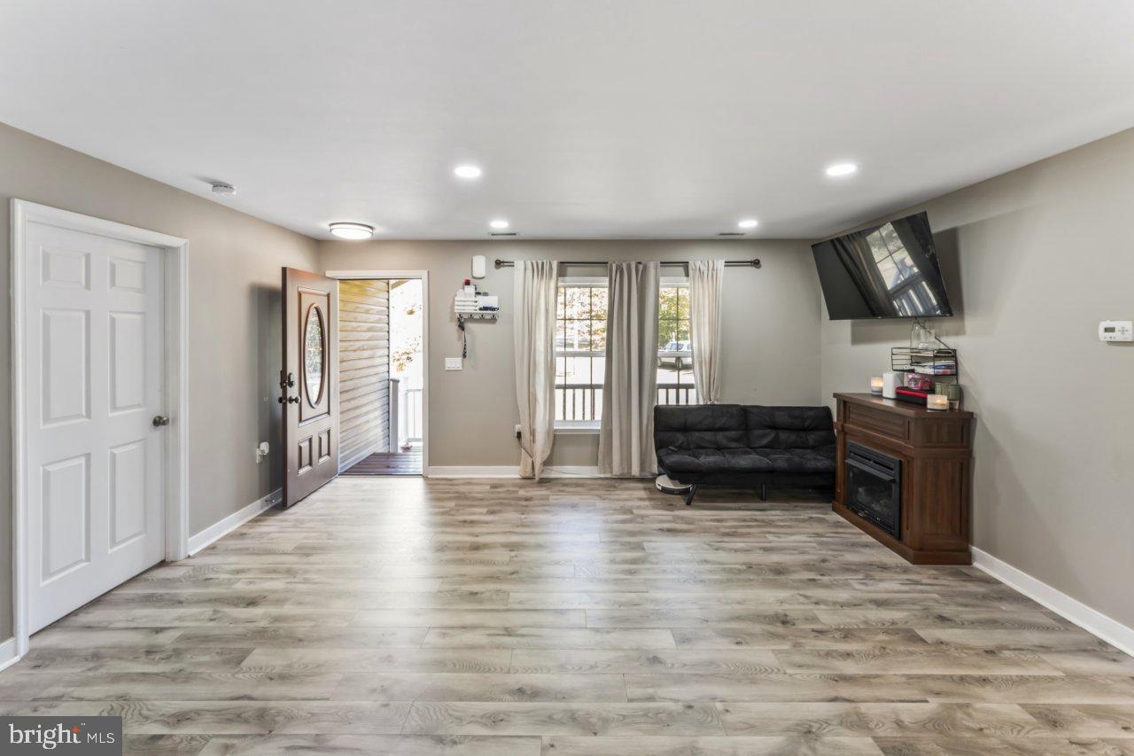 166 Bootons Lane Orange, VA 22960 - Photo 5 of 24 a view of empty room with wooden floor and window