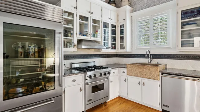 a view of a room with furniture and wooden floor