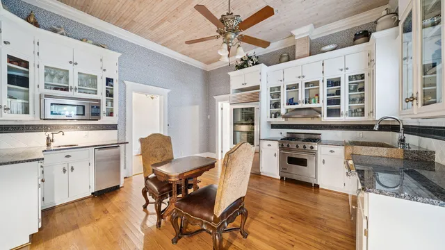 a kitchen with a stove and a sink