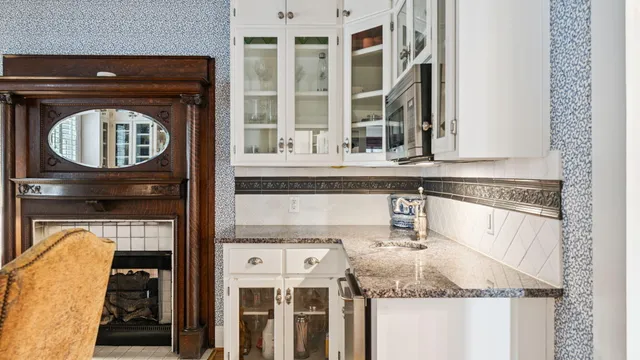 a bedroom with furniture and a large window