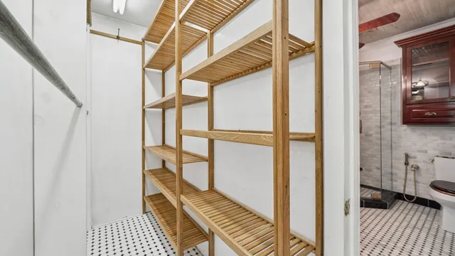 a view of a patio with table and chairs under an umbrella