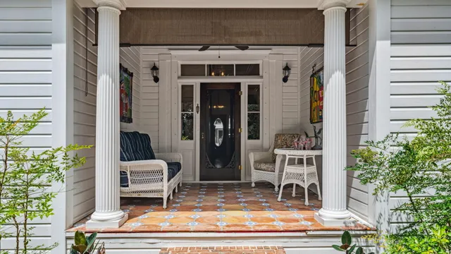 a front view of house with a garden
