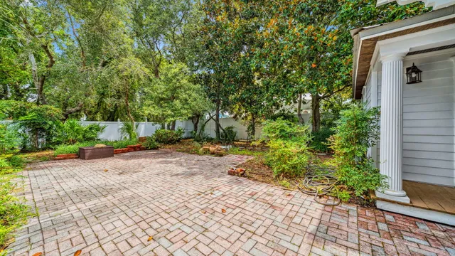 an aerial view of a house with garden space and street view