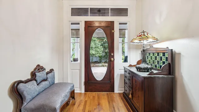 a view of a livingroom with a fireplace and window