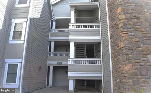 a view of a building with a door and a window
