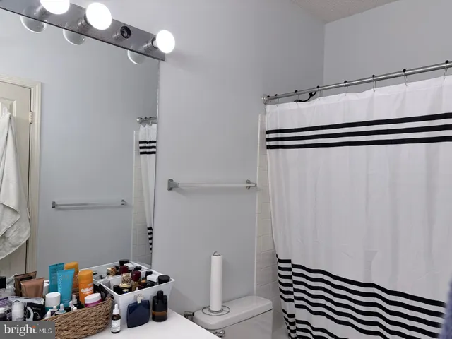 a view of a storage & utility room with two washing machine