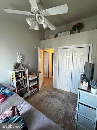 a bedroom with furniture and a chandelier