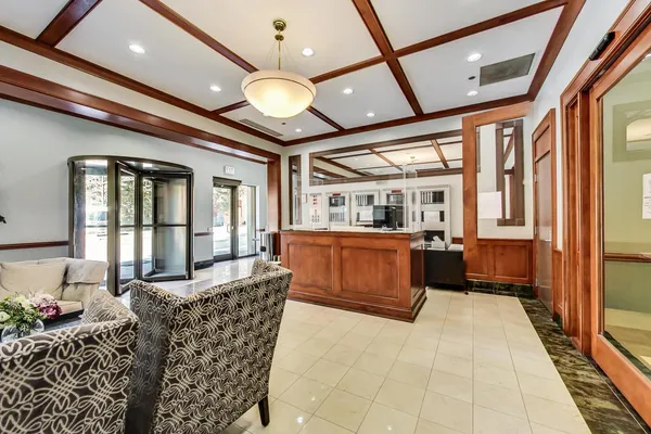 a large room with a large window and furniture