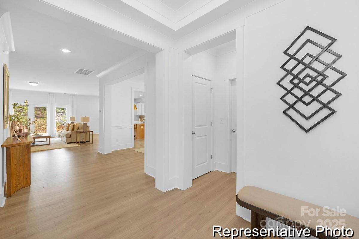 116 Soft Breeze Bend, Unit 163B Locust, NC 28097 - Photo 13 of 30 a view of livingroom with furniture and wooden floor