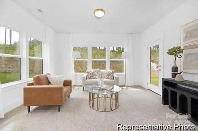 a living room with furniture and window