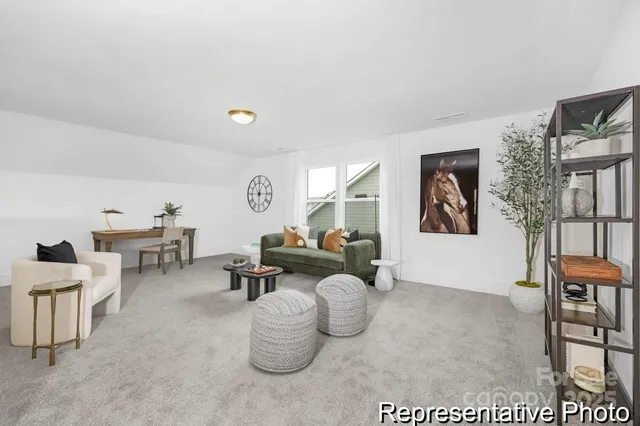 a living room with furniture and a table