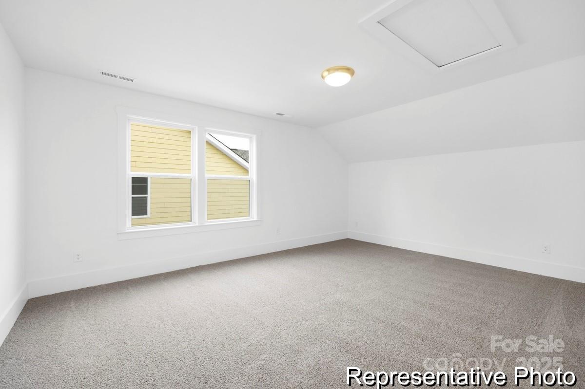116 Soft Breeze Bend, Unit 163B Locust, NC 28097 - Photo 20 of 30 an empty room with a window