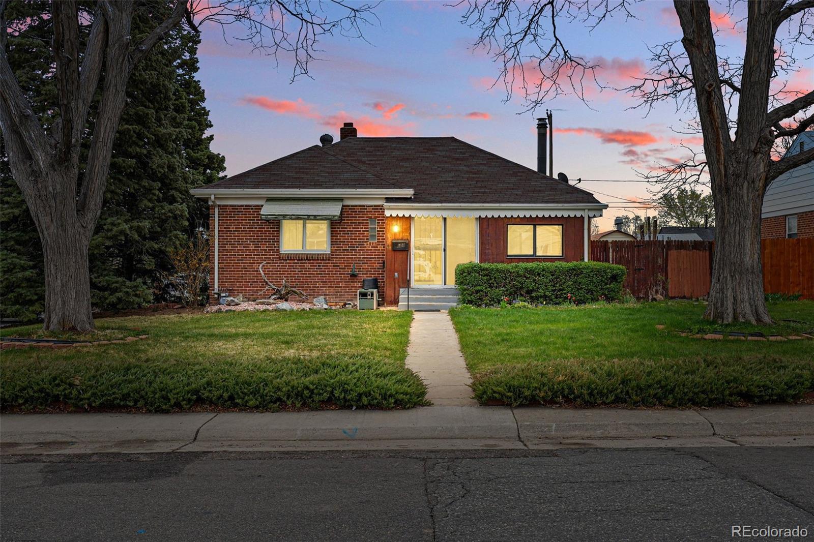 500 South Decatur Street Denver, CO 80219 - Photo 2 of 46 a front view of a house with a yard