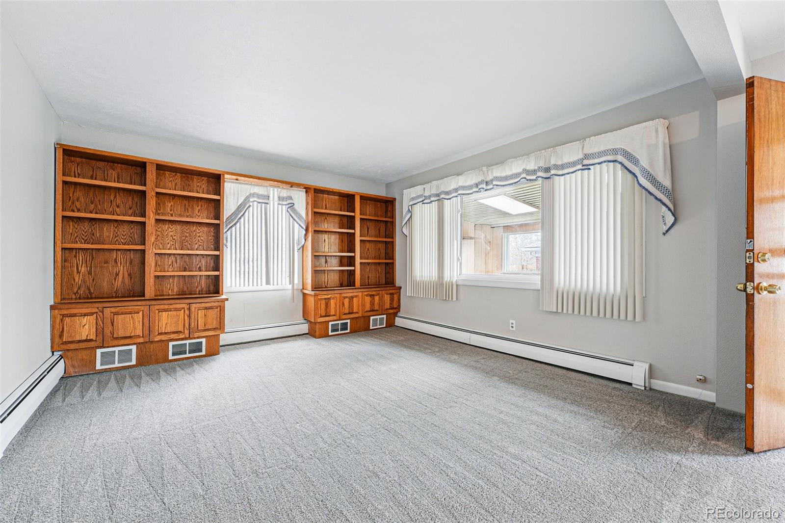 500 South Decatur Street Denver, CO 80219 - Photo 22 of 46 an empty room with a fireplace and window