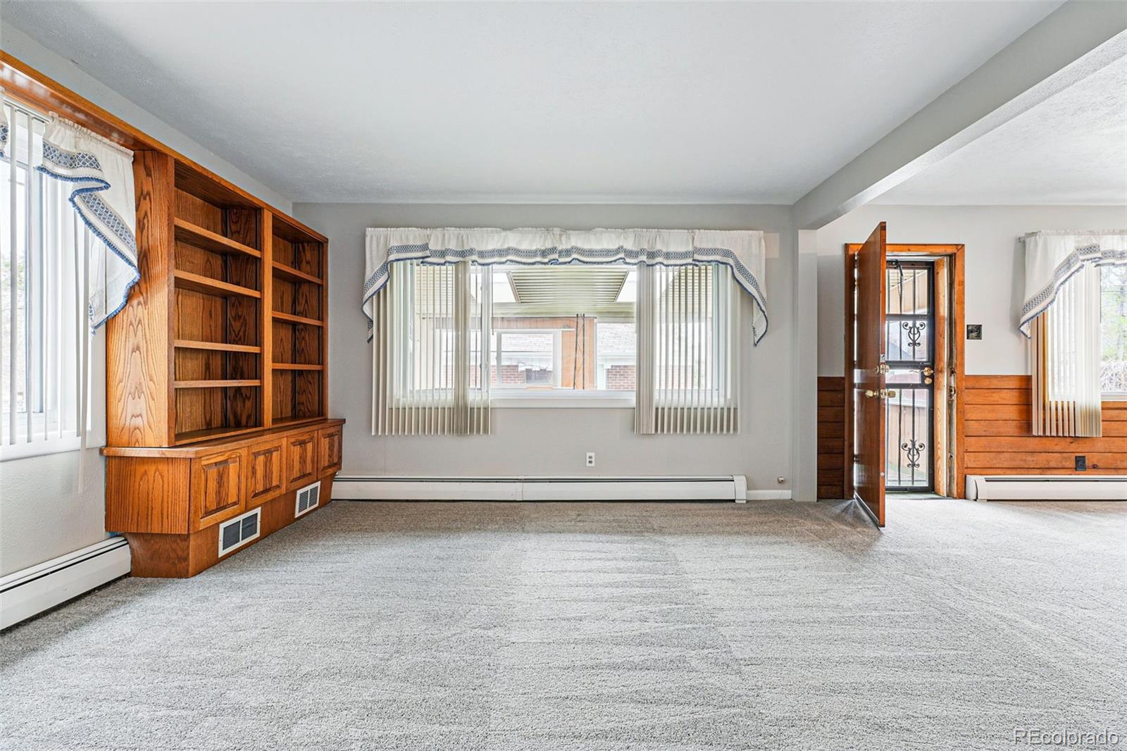 500 South Decatur Street Denver, CO 80219 - Photo 23 of 46 an empty room with wooden floor and windows