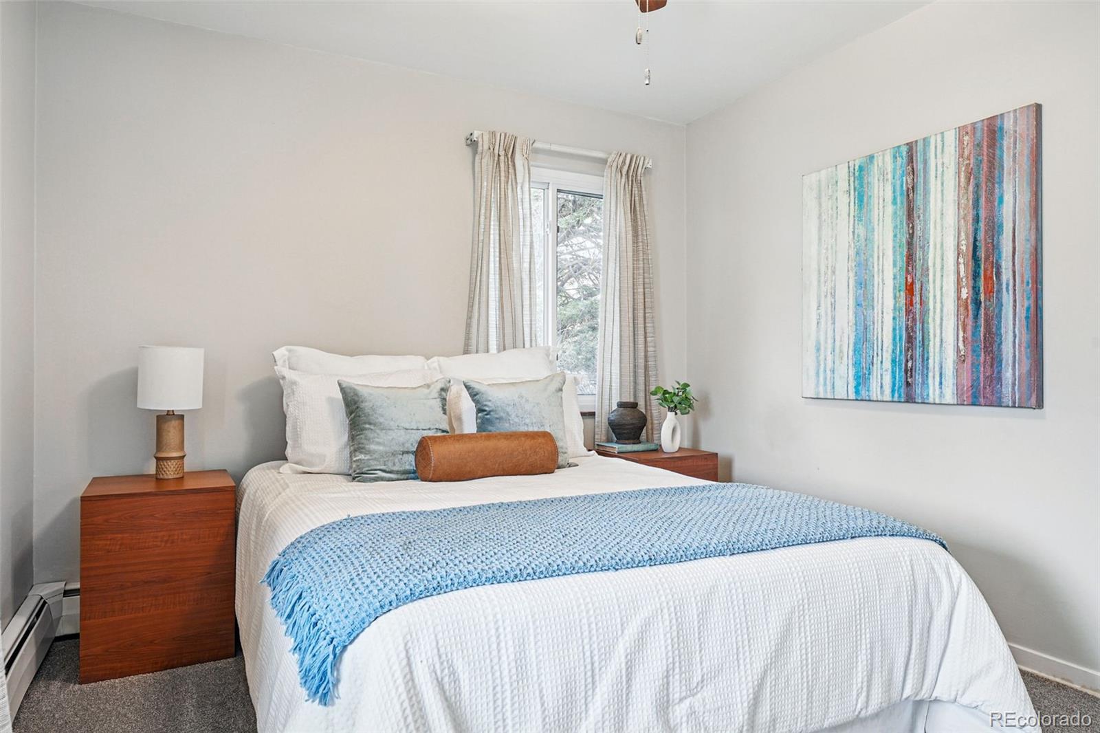 500 South Decatur Street Denver, CO 80219 - Photo 27 of 46 a bedroom with a bed and a window