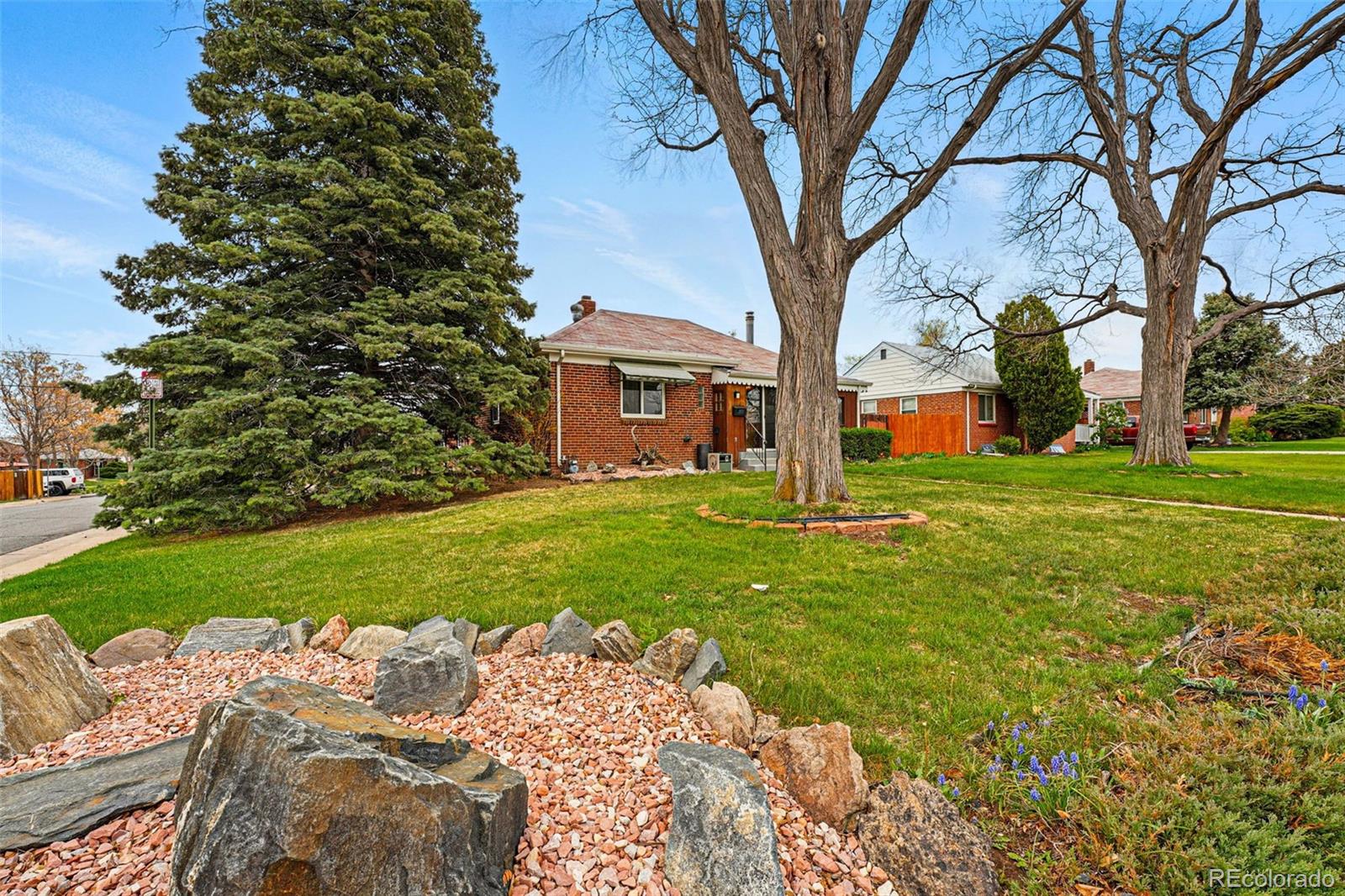 500 South Decatur Street Denver, CO 80219 - Photo 3 of 46 a front view of a house with garden