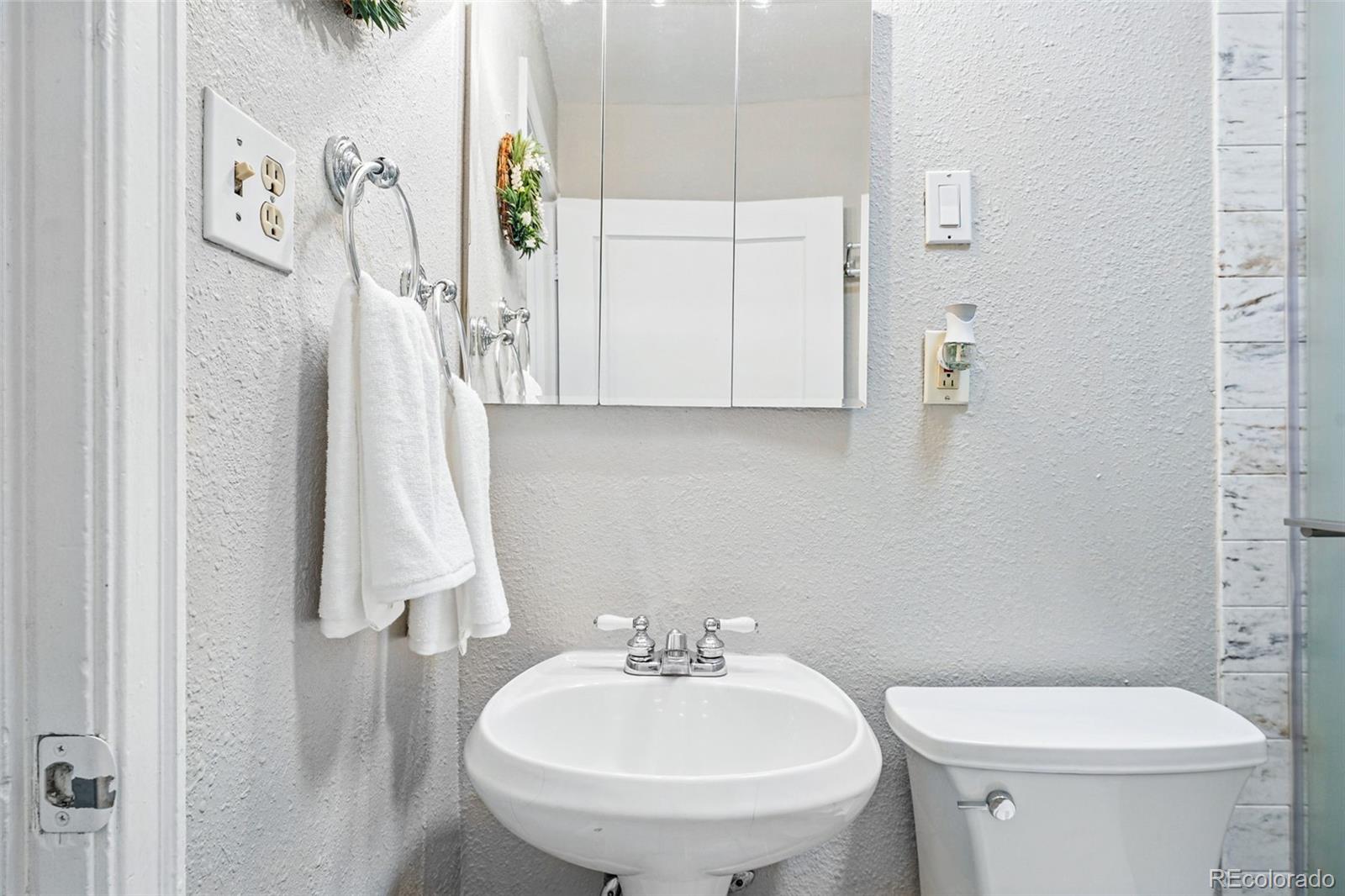 500 South Decatur Street Denver, CO 80219 - Photo 32 of 46 a bathroom with a sink and a toilet