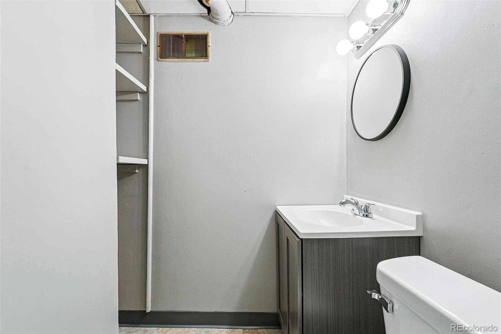 500 South Decatur Street Denver, CO 80219 - Photo 37 of 46 a bathroom with a sink and a mirror