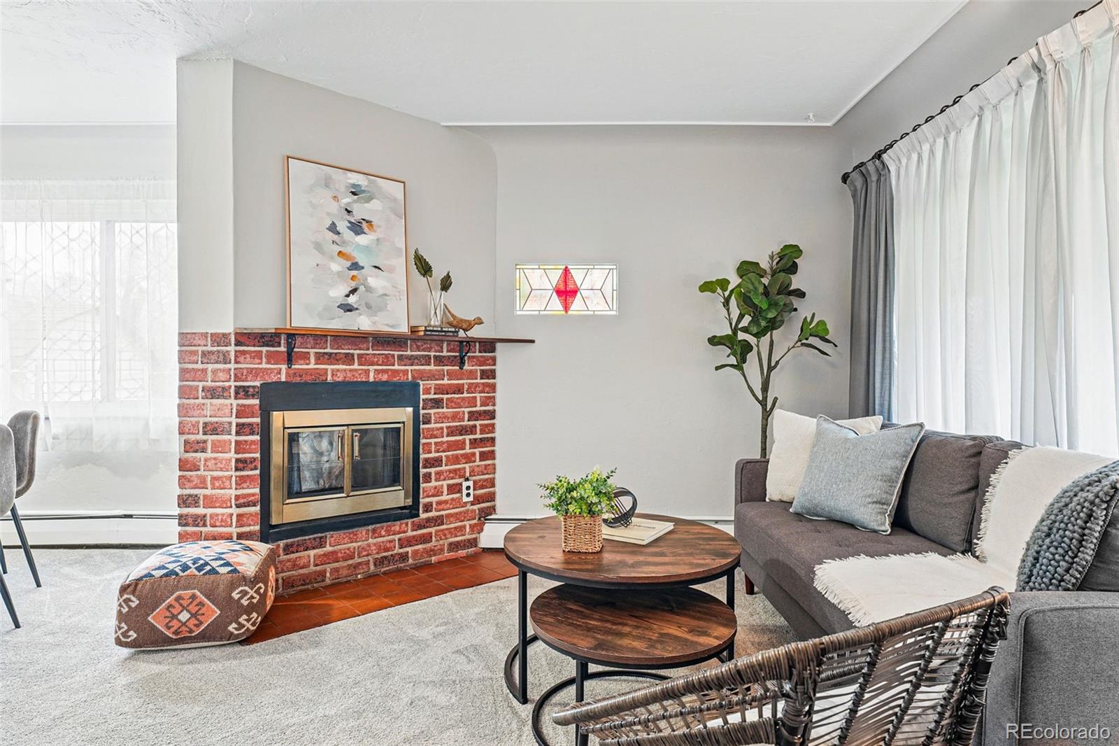 500 South Decatur Street Denver, CO 80219 - Photo 8 of 46 a living room with furniture and a fireplace
