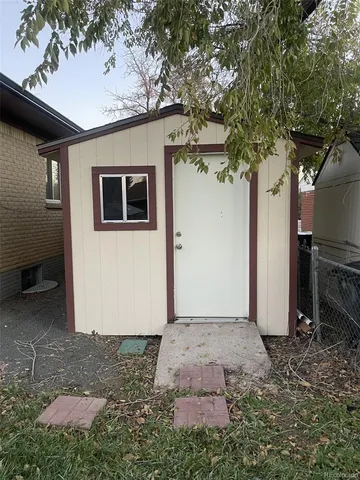an aerial view of multiple houses with a yard