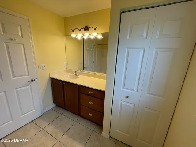 a bathroom with a double vanity sink and mirror