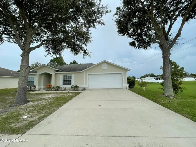 a front view of a house with yard