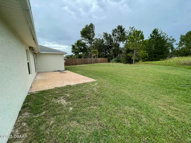 a aerial view of a house with garden