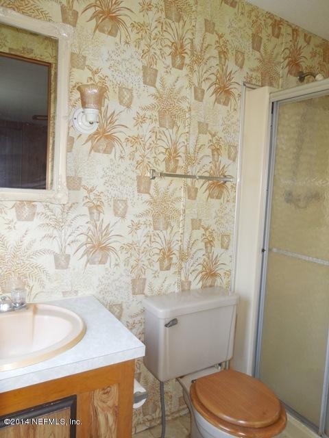 117 Ketner Road Welaka, FL 32112 - Photo 14 of 30 a bathroom with a sink and a toilet