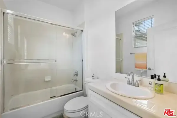 a bathroom with a sink a toilet and a bathtub