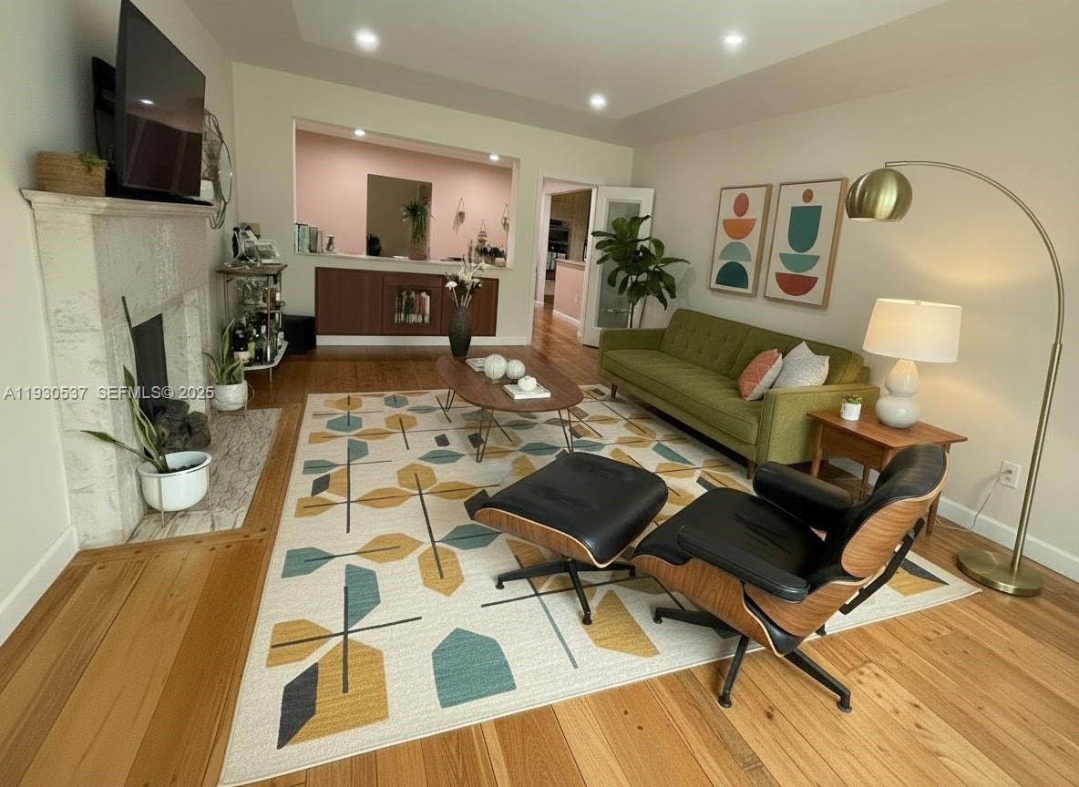 40 Southwest 30th Road Miami, FL 33129 - Photo 3 of 16 a living room with furniture and a flat screen tv