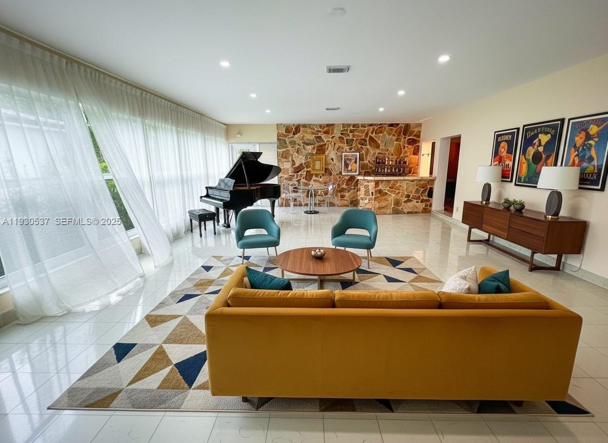 40 Southwest 30th Road Miami, FL 33129 - Photo 5 of 16 a living room with furniture and a view of kitchen